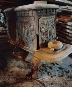 Antique cast iron wood stove...missing a couple legs