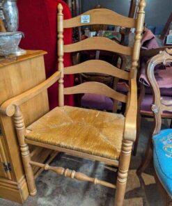 Wooden ladder back chair with woven rush seat