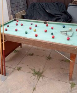 Good little pool table with balls and cues 72 in by 39 in