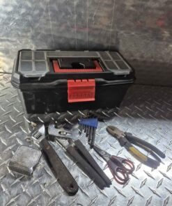 Black tool box with assorted tools and contents