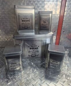 Antique look 5 piece metal cannister set ....1 lid has rust