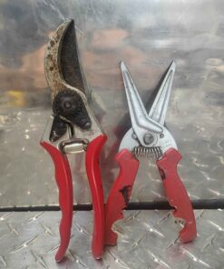 Red handled pruning shears and red cutters